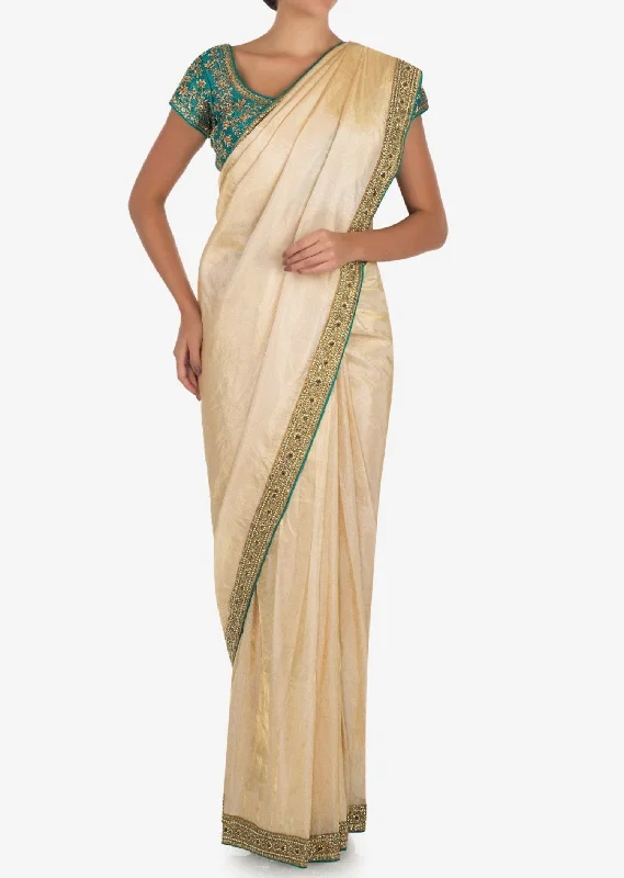 Cream saree with dark green blouse Casual Stripe Blouse