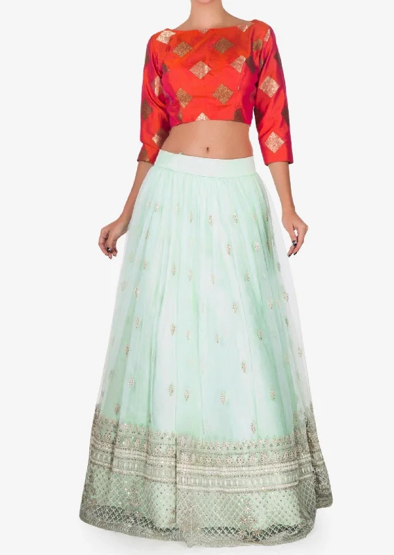 Mint blue lehenga with a orange brocade silk blouse embellished in thread work Silky Draped Blouse