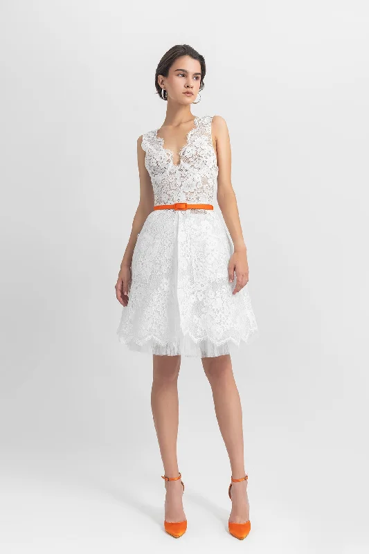 Deep V-neckline lace top, paired with a cage-like lace skirt and a detachable belt. corduroy skirt cozy
