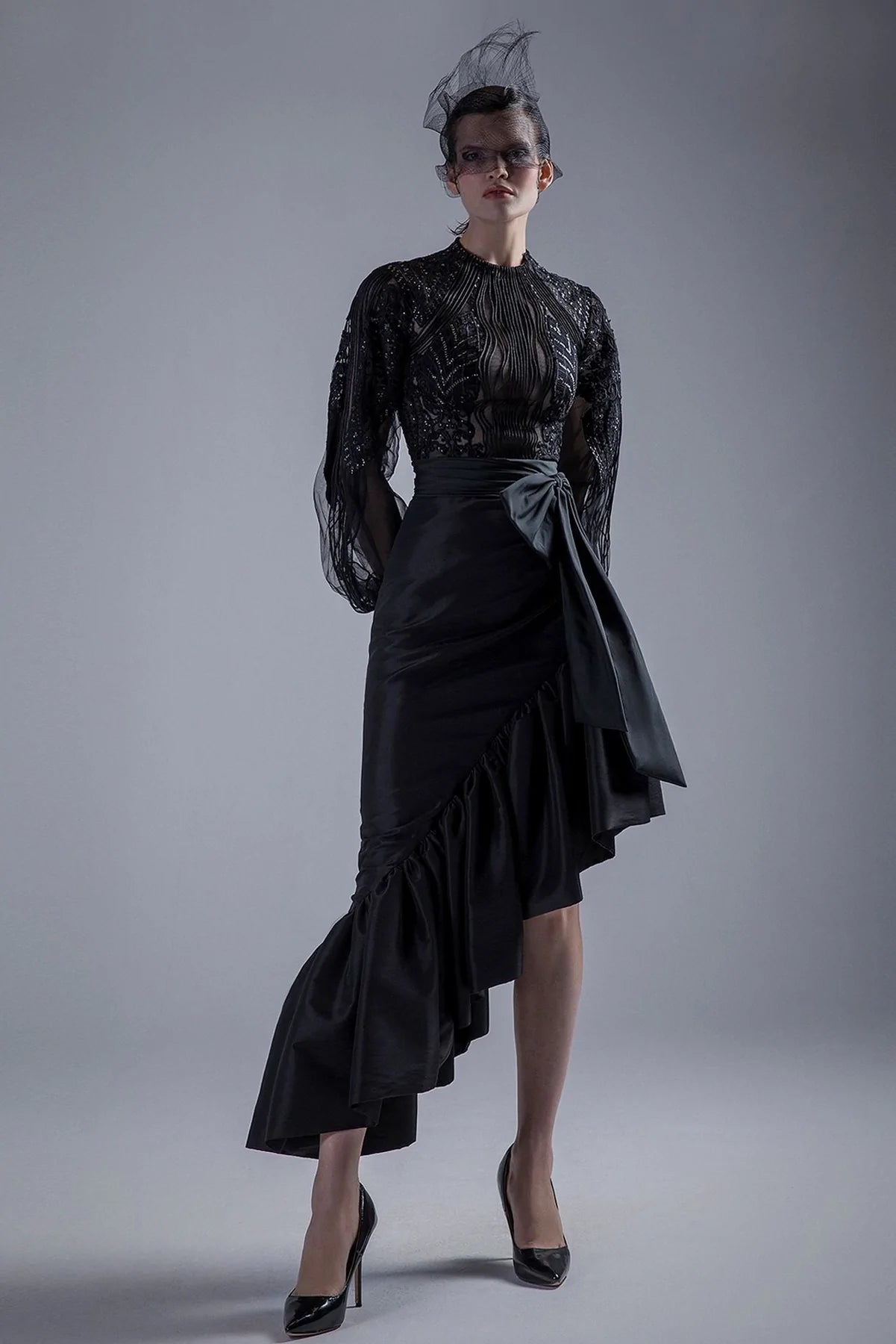 High neck beaded bodice with ruffled skirt leather skirt sleek